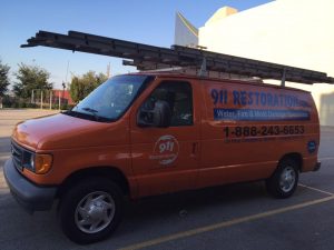 Water Damage and Mold Removal Van At Commercial Job Site