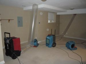 Water Damage Restoration Being Conducted In A Residential Home